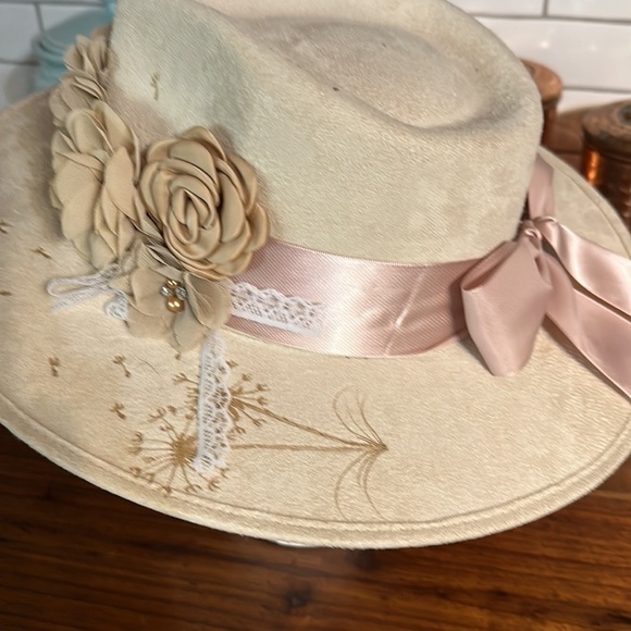 - Beautiful hand burned cowboy hat. Great fit.  Medium   Floral band